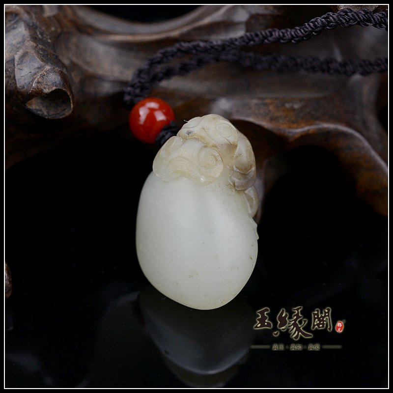 褐皮籽料挂件 金钱如意